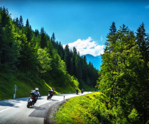 Bikers in mountainous tour, travelling across Europe, curve highway in mountains, scene destinations, extreme transport, active lifestyle